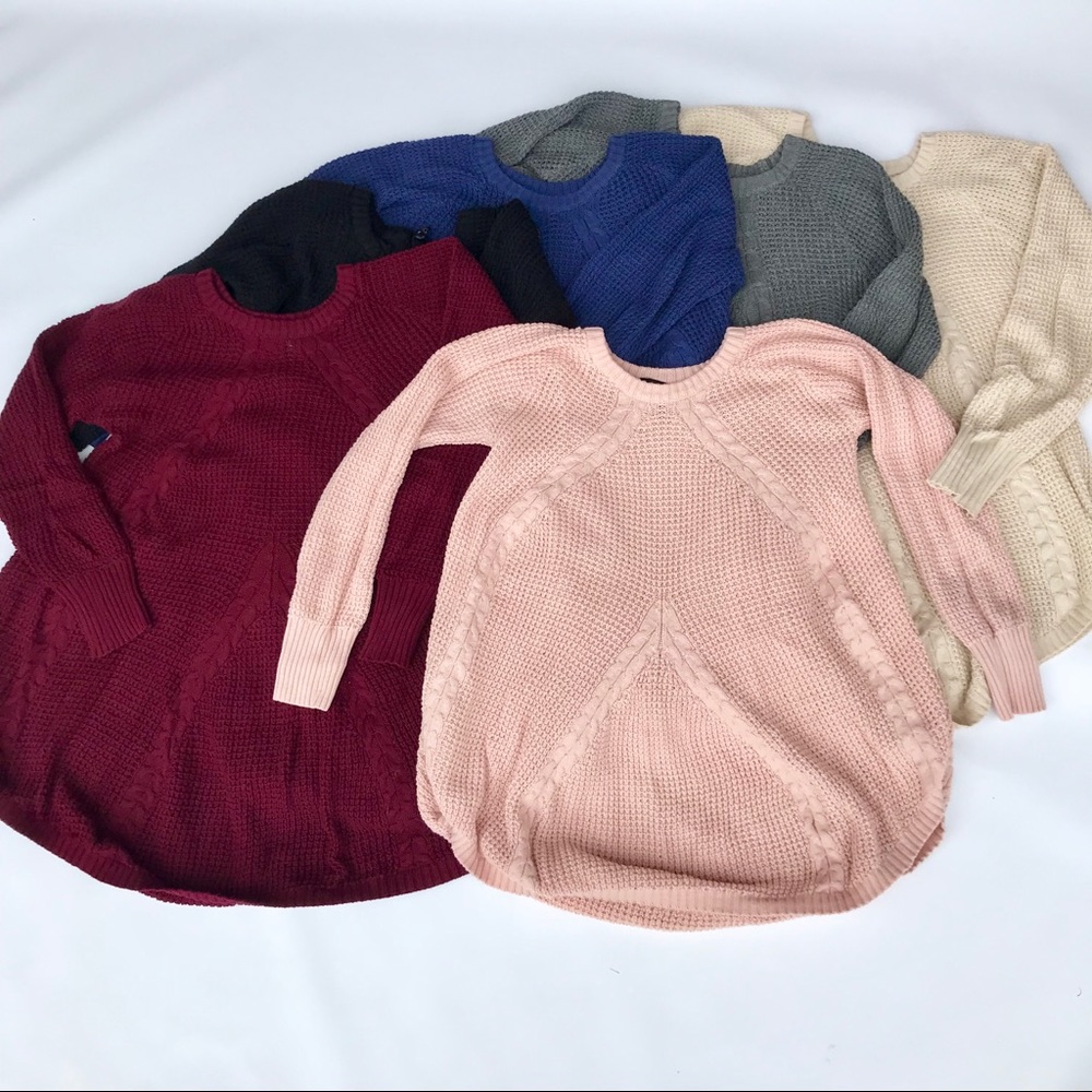 Long sleeve billowing cable knit sweater.